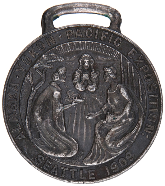 “ALASKA YUKON PACIFIC EXPOSITION” LOGO WITH ART NOUVEAU LADIES ON 1909 SILVERED BRASS “OFFICIAL” WATCH FOB.