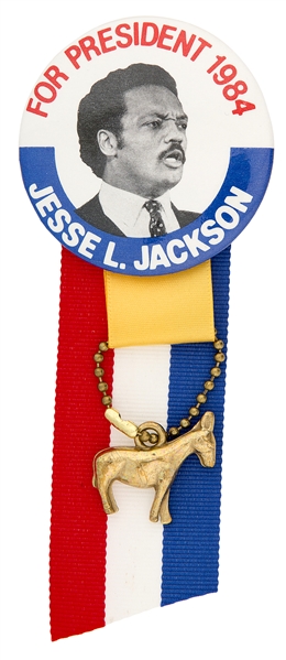 “FOR PRESIDENT 1984 / JESSE L. JACKSON” HOPEFUL PICTURE BUTTON WITH RIBBON AND DONKEY HANGER.