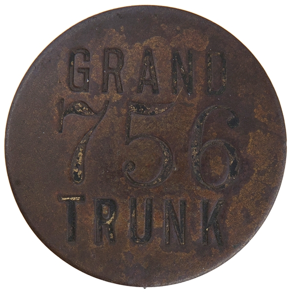 “GRAND TRUNK” NUMBERED BRASS EMPLOYEE RAILROAD BADGE.