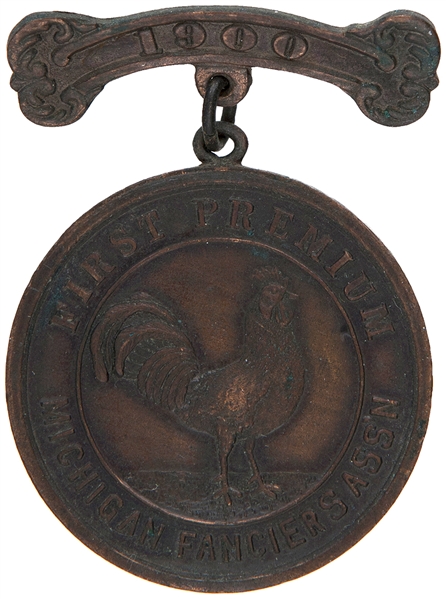 “1900 FIRST PREMIUM MICHIGAN FANCIER ASS’N” BRONZE LUSTER POULTRY ASSOCIATION BADGE.